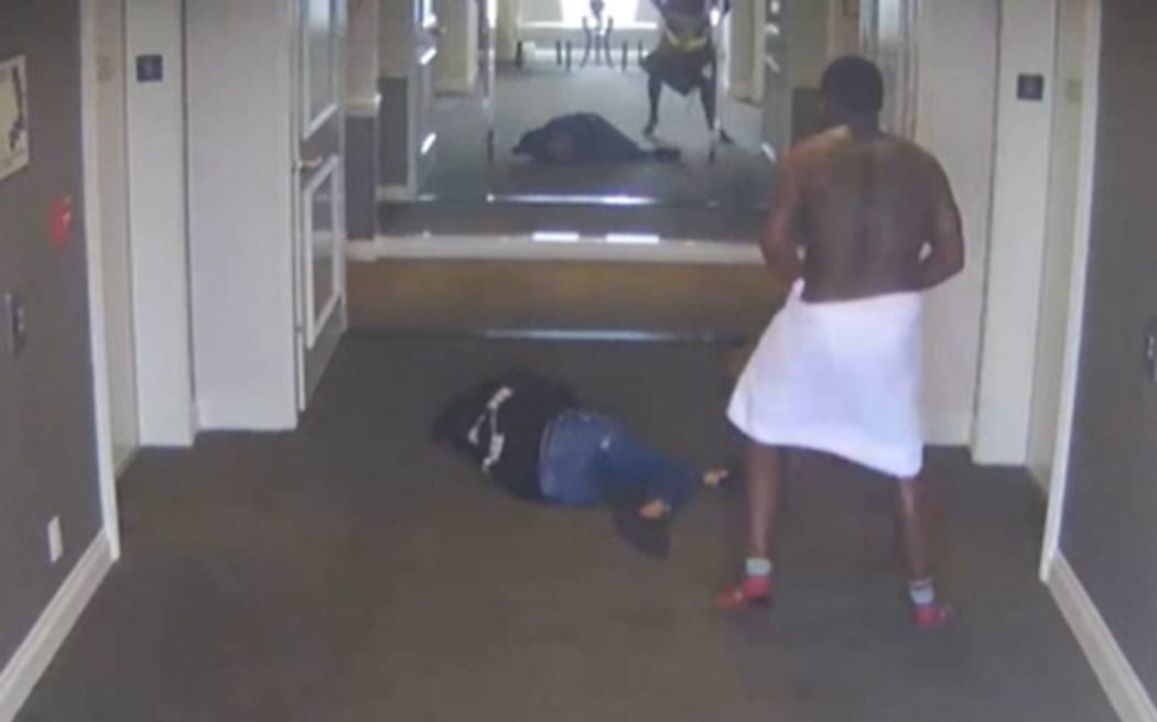 A screenshot of a video released by CNN appearing to show Sean 'Diddy' Combs assaulting singer Casandra 'Cassie' Ventura in a hotel hallway in 2016.