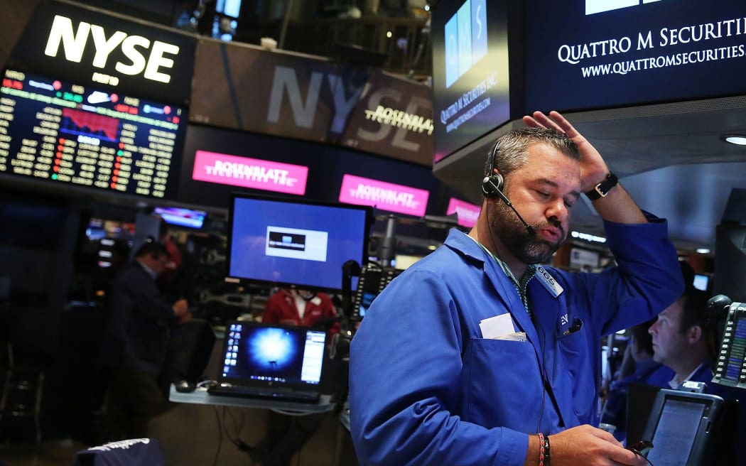 A trader on the floor of the New York Stock Exchange as the global economy continues to react from events in China, on what is being called Black Monday, August 24, 2015.