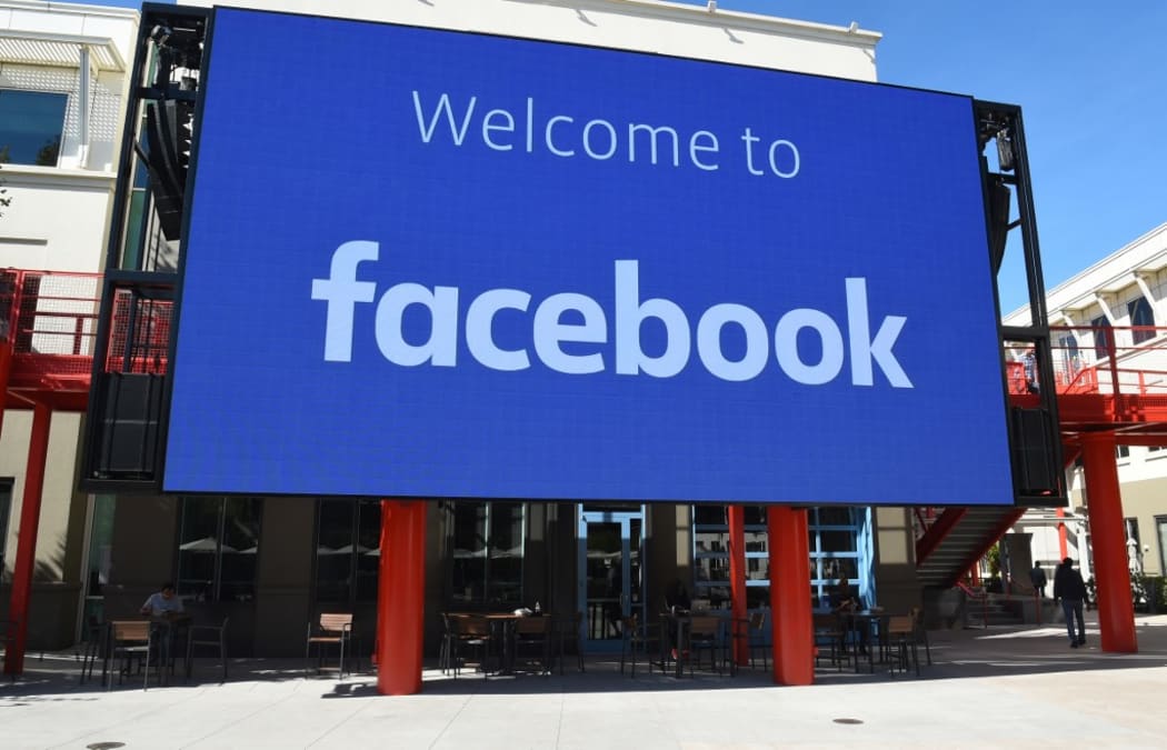 (FILES) In this file photo taken on October 23, 2019 a giant digital sign is seen at Facebook's corporate headquarters campus in Menlo Park, California.