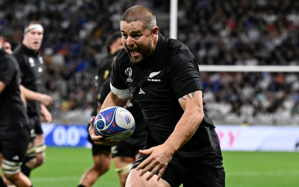 All Black Dane Coles heads for the try line during NZ's 96-17 demolition of Italy at the Rugby World Cup.