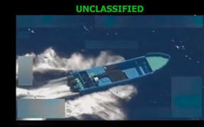 This screen grab from a video posted by US Defense Secretary Pete Hegseth on his X account on 22 October, 2025, shows what Hegseth says is US military forces conducting a strike on a vessel being operated by a "designated terrorist organization conducting narco-trafficking" in the Eastern Pacific Ocean on 21 October, 2025.