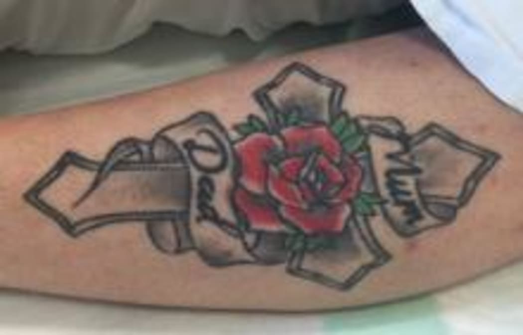 Police are trying to identify a woman with this tattoo, after she was found with serious head injuries north of Auckland.
