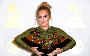 Adele, winner of Album Of The Year and Best Pop Vocal Album and Song Of The Year, Record Of The Year and Best Pop Solo Performance.