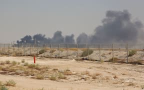 Smoke billows from an Aramco oil facility in Abqaiq about 60km southwest of Dhahran in Saudi Arabia's eastern province on September 14, 2019.