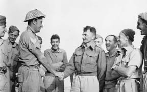 Charles Upham (centre) pictured with members of his platoon in North Africa, November 1941.