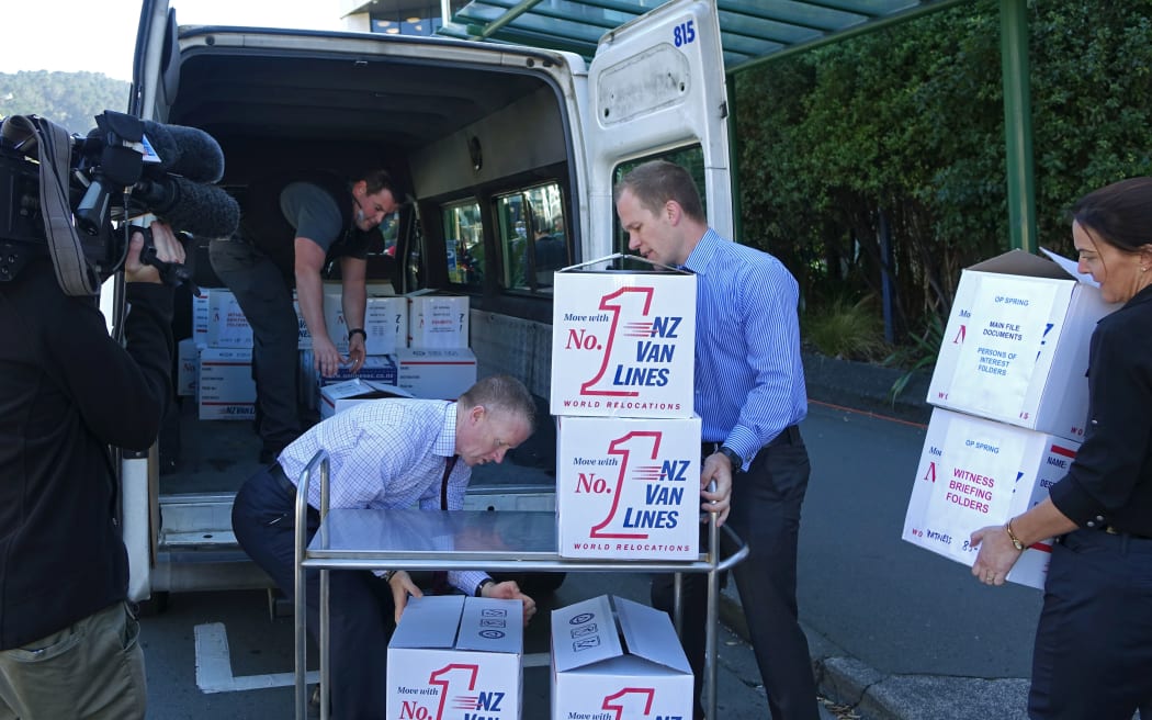The Crown loading up their files outside the High Court in Wellington.