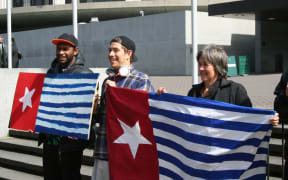 Green Party MP Catherine Delahunty (right) and others at a rally outside NZ's parliament calling for media freedom in West Papua.