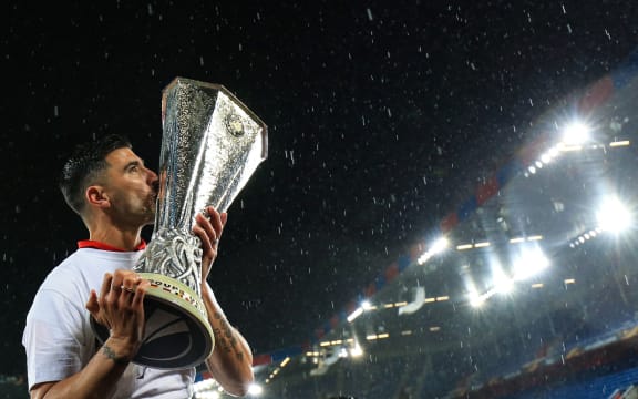 Jose Antonio Reyes of Sevilla celebrates, kissing the Europa League Trophy 2016.