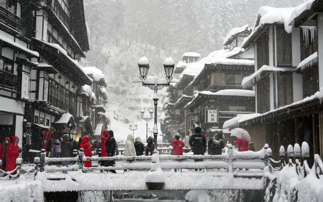 Snow covers Ginzan Onsen, a hot spring resort in Obanazawa, Yamagata Prefecture, northeastern Japan, on 23 December 2024.