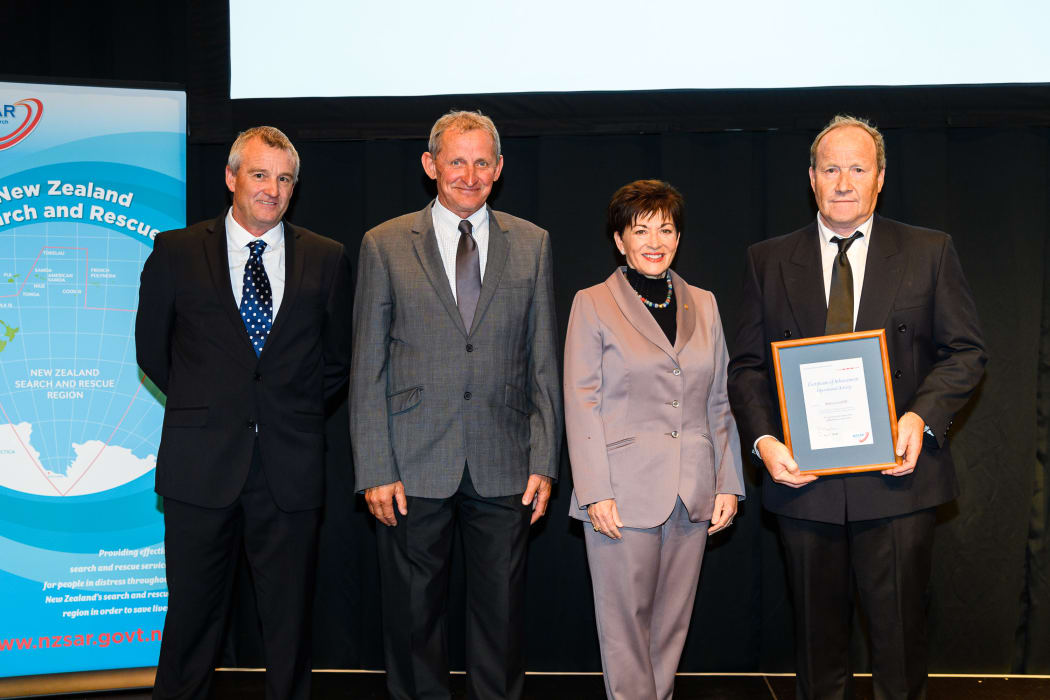 Methven rescue team. Brent McDonald, Russell Currie and Don Geddes with Dame Patsy Reddy.
