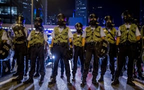 Police officers stand guard during clashes with pro-democracy protesters in Hong Kong on September 28.