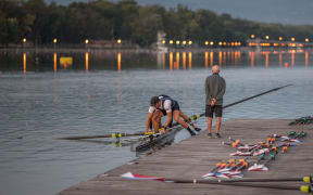 Rowing coach Noel Donaldson watches on.