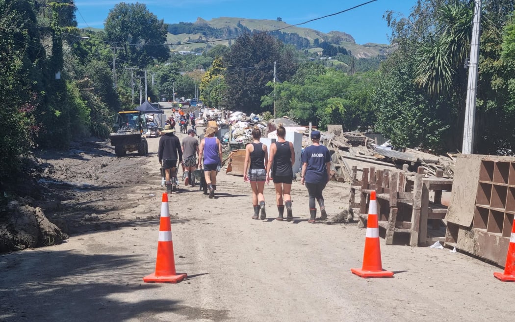 Houses on Joll Road in Havelock North were inundated with contaminated mud during Cyclone Gabrielle, but the community and Navy pitched in to help clean up the street and homes.