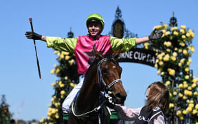 Jockey Robbie Dolan celebrates after riding Knights Choice to victory in the the 2024 Melbourne Cup at Flemington Racecourse in Melbourne,