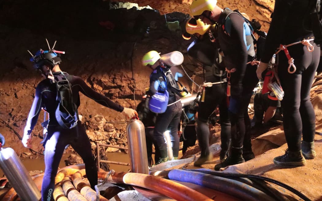 Photo taken recently by the Royal Thai Navy on 7 July, 2018 shows a group of Thai Navy divers in Tham Luang cave during rescue operations for the 12 boys and their football team coach trapped in the cave.