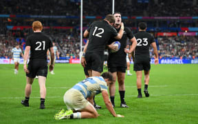 Will Jordan of New Zealand celebrates with teammate Jordie Barrett scoring his team's seventh try during the Rugby World Cup France 2023 semi-final match between Argentina and New Zealand at Stade de France