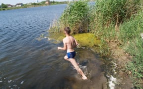 child swim and having fun in the river