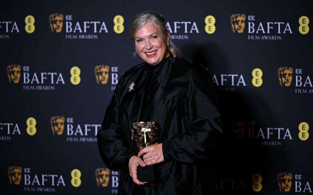 New Zealand costume designer Kate Hawley poses with the award for Best costume design for "Frankenstein" during the BAFTA British Academy Film Awards ceremony at the Royal Festival Hall, Southbank Centre, in London, on February 22, 2026.