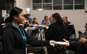 Paige Isaia (14) serving at the Mangere Soup Kitchen