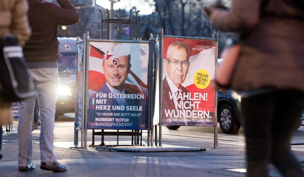Two election placards of the presidential candidates Norbert Hofer (l - FPÖ) and Alexander Van der Bellen stand side-by-side on 03 December 2016 in Vienna, Austria.