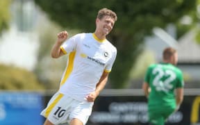 Reid Drake celebrates scoring a goal for Eastern Suburbs against Canterbury United.