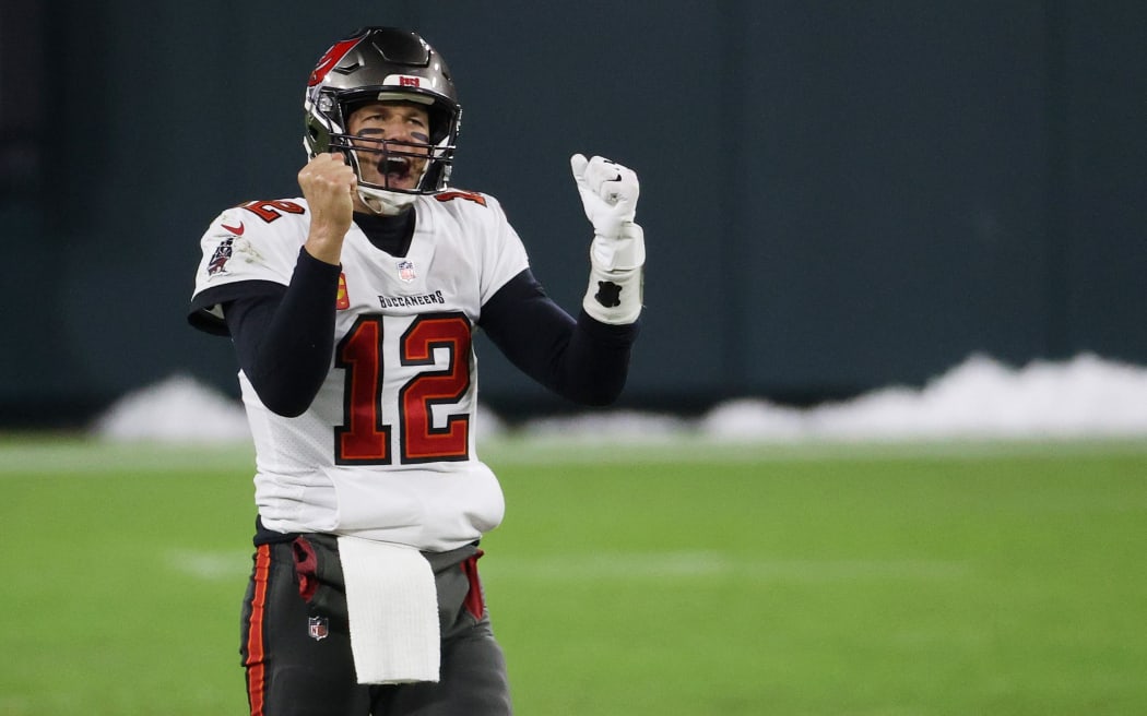 Tom Brady #12 of the Tampa Bay Buccaneers celebrates in the final seconds of their 31 to 26 win over the Green Bay Packers during the NFC Championship game at Lambeau Field on January 24, 2021 in Green Bay, Wisconsin.