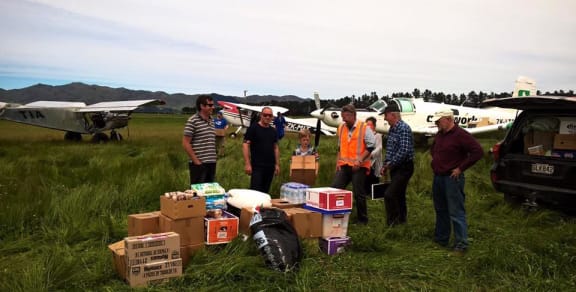 Members of the farming community come together to get supplies out to isolated farmers.