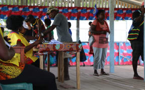 Voters file through a polling booth in Buka town to cast their vote for the Bougainville independence referendum.