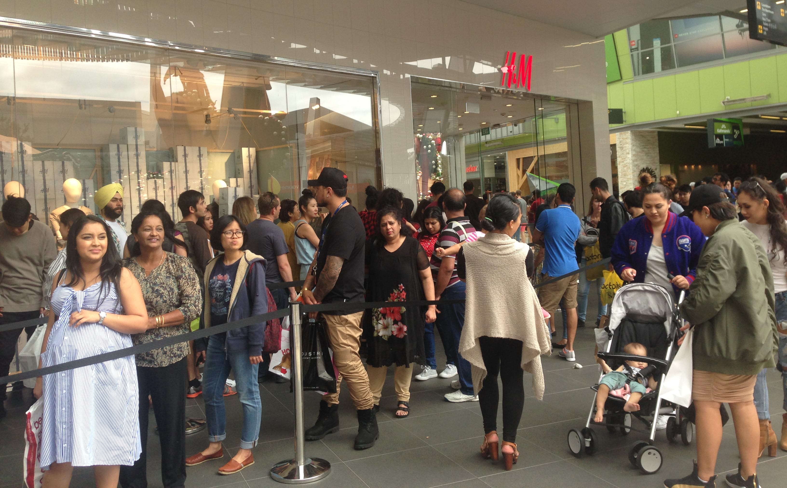 Long queues of shoppers waited to get into clothing retailer H & M at Auckland's Sylvia Park Mall.