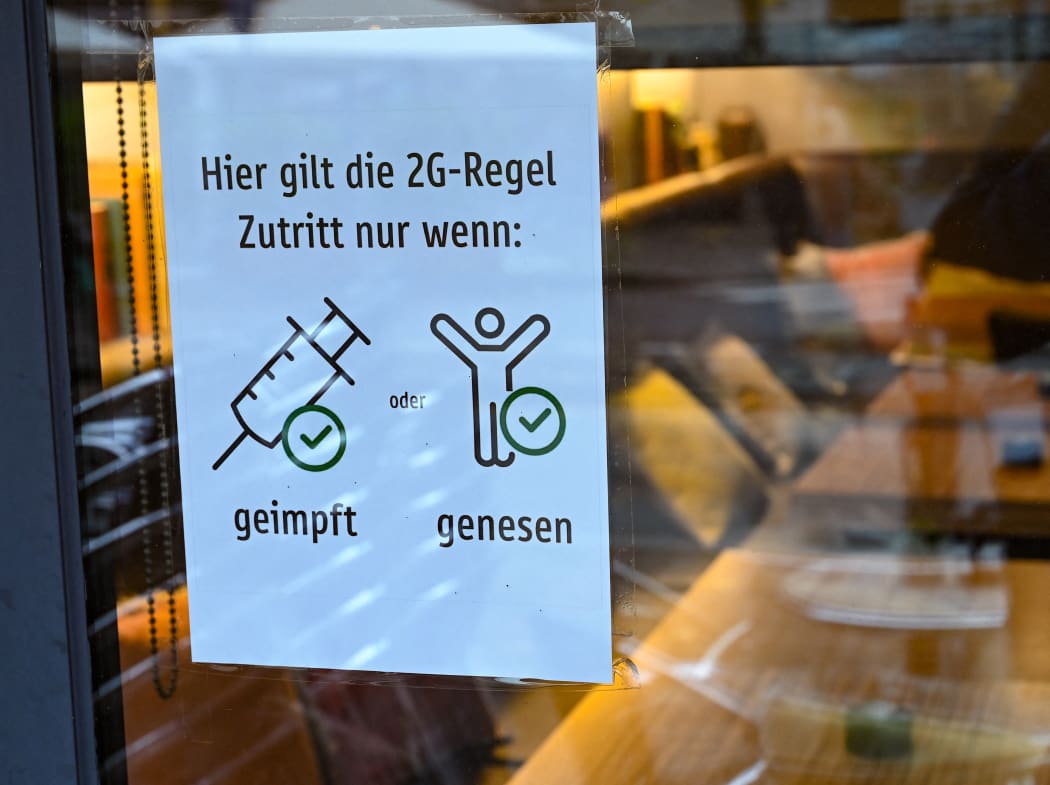 Poster on cafe window in Hessen, Frankfurt/Main, Germany saying: "The 2G rule applies here. Admission only if vaccinated or recovered".