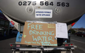 One of at least five water tankers set up around the town.