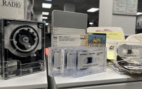 Audio recordings, CDs, lists of hit songs, a copy of The Dominion newspaper and a staff newsletter are among the items discovered in a public radio time capsule, found hidden in a tunnel by Parliament's security services.