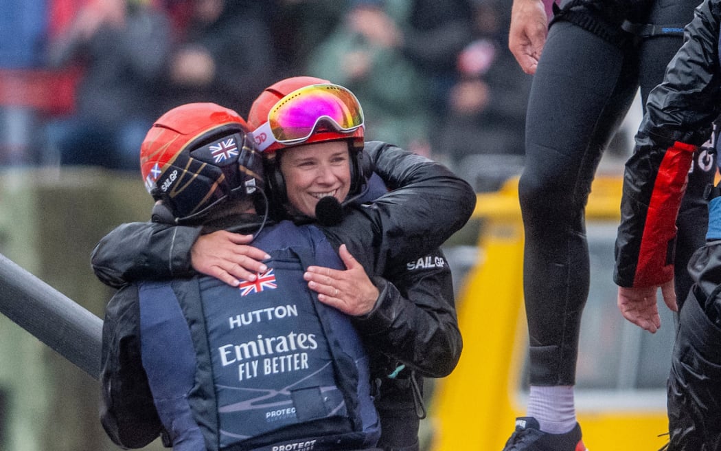 Hannah Mills, strategist of Emirates Great Britain SailGP Team, hugs Nick Hutton, grinder of Emirates Great Britain SailGP Team, as Emirates Great Britain SailGP Team celebrate winning the ROCKWOOL Canada Sail Grand Prix in Halifax, Canada. Sunday 2nd June 2024. Photo: Ricardo Pinto for SailGP. Handout image supplied by SailGP