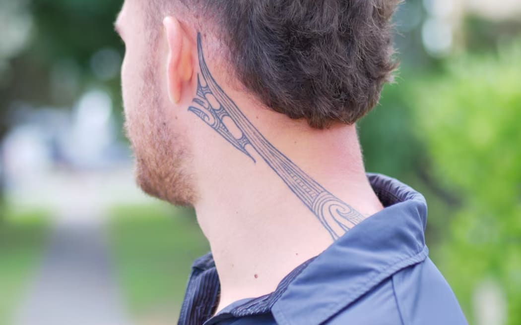 Caleb Pokai's tā moko represents strength and carrying the weight of his family.