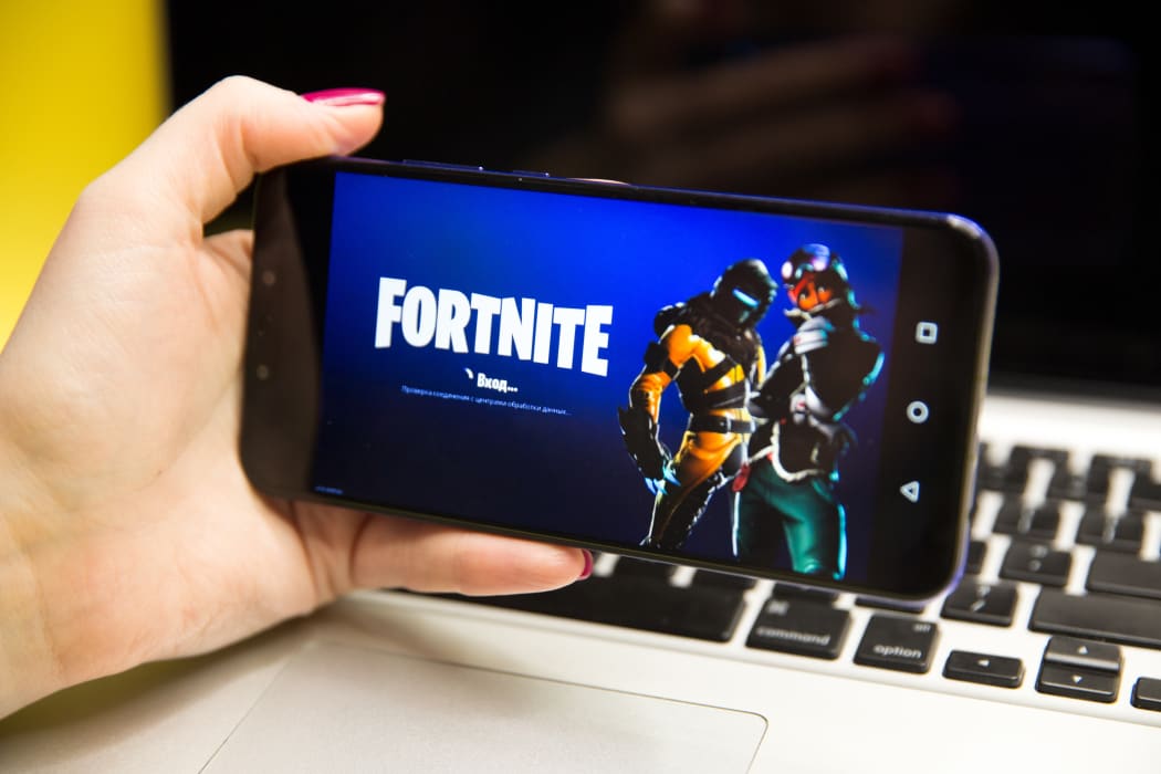 Tula, Russia - JANUARY 29, 2019 - Fortnite video game screen with character and console controller. Fortnight Battle Royale online gaming by Epic Games