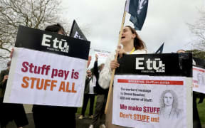 Staff at Stuff in Auckland are striking over low pay offers and what they say are attempts to divide the workforce. 28 August 2025