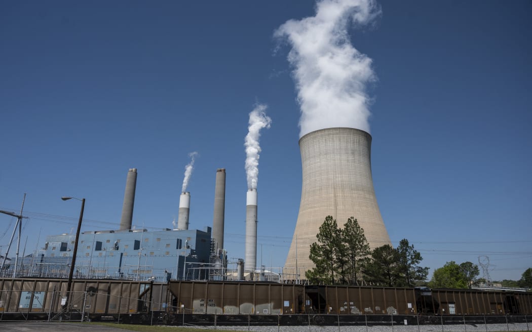 Steam rises from the Miller coal Power Plant in Adamsville, Alabama, 13 April 2021.