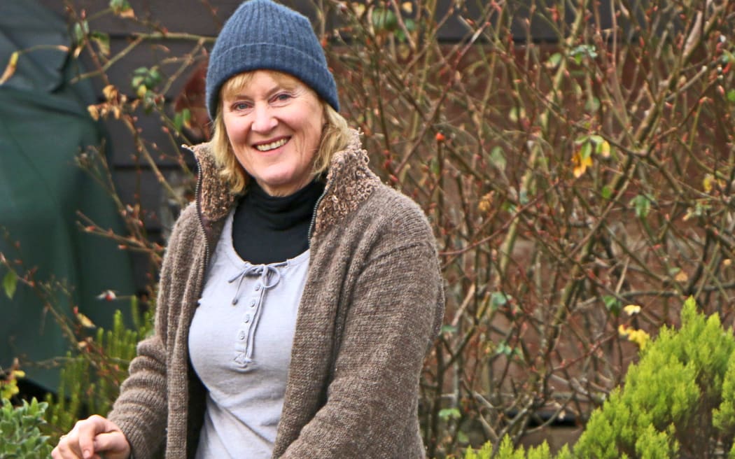 Woman in beanie in the garden