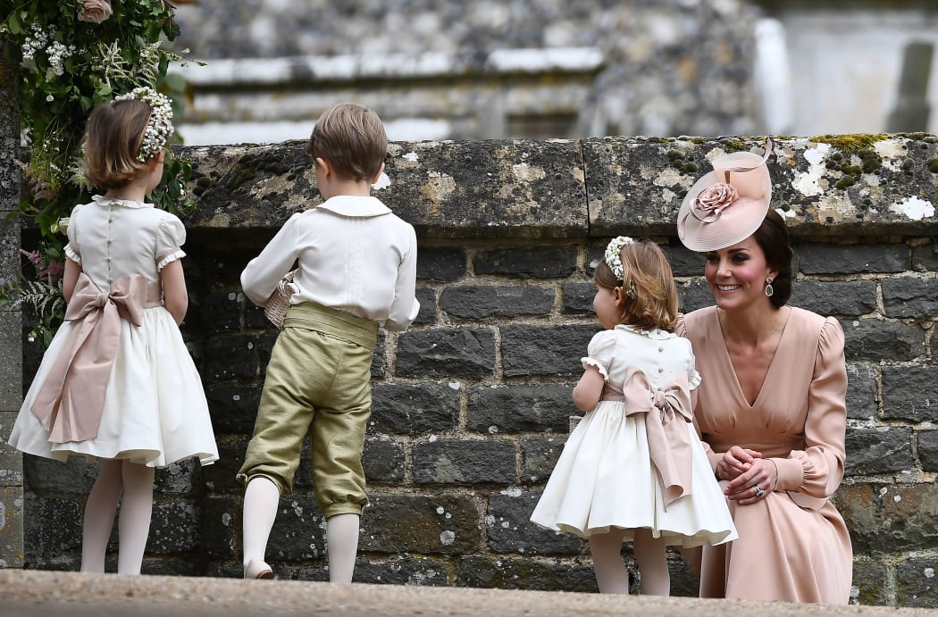 Britain's Catherine, Duchess of Cambridge (R) stands with her daughter Britain's princess Charlotte,