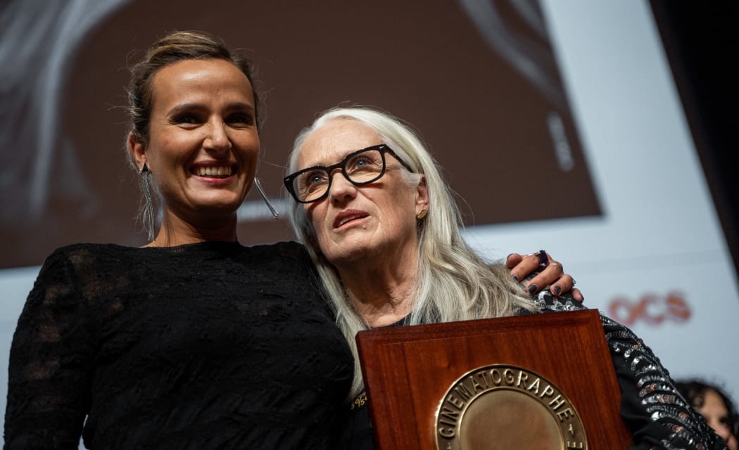 Jane Campion receives the Lumiere award from Julia Ducournau at the Lumiere award ceremony during the thirteenth edition of the Lumiere festival.