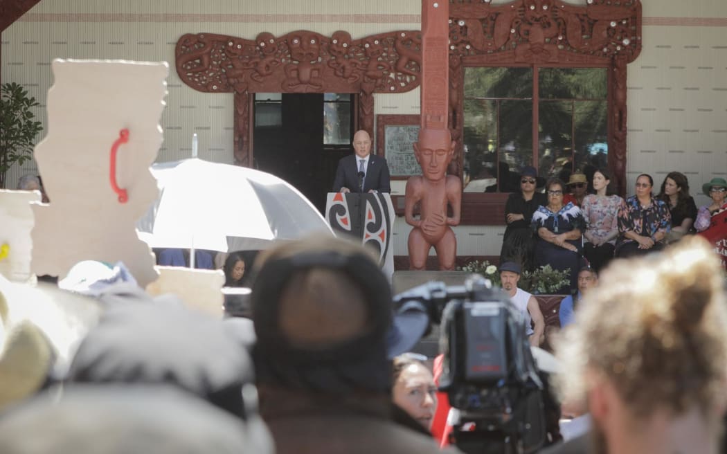 Prime Minister Christopher Luxon speaks to the crowd at Waitangi on 5 February.