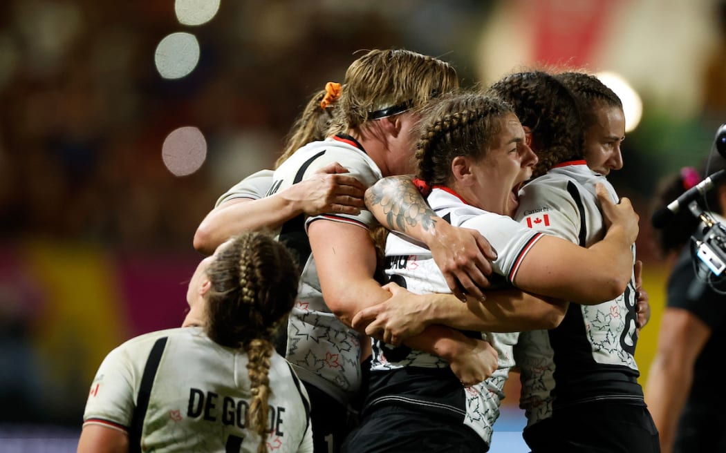 Canada players celebrate victory over the Black Ferns.