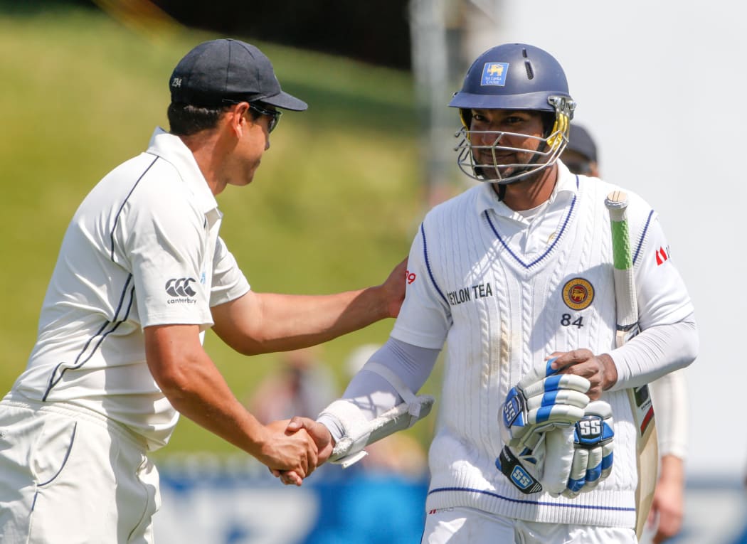 Ross Taylor congratulates Kumar Sangakkara on his century on the second day of the second test.