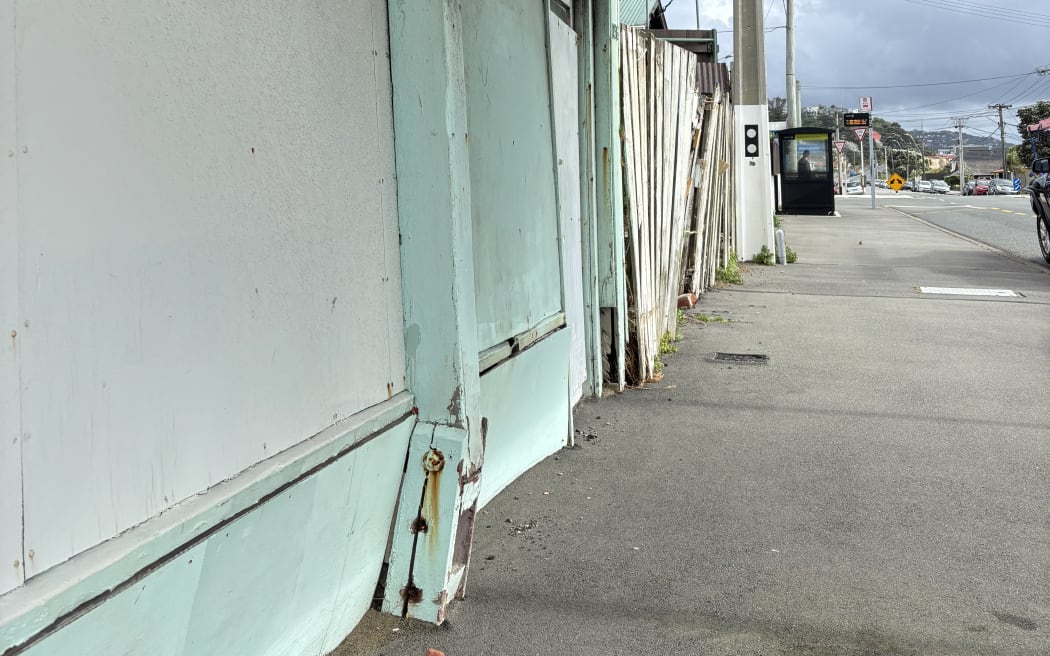 A pillar supporting the building’s veranda bulges towards the pavement.