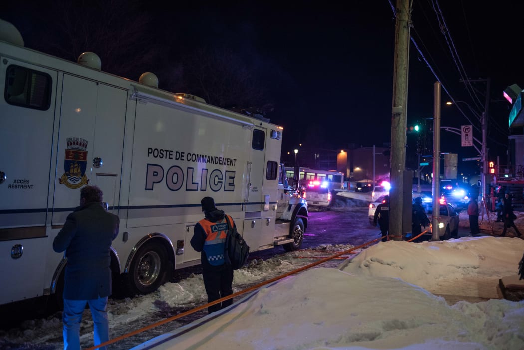 Police officers respond to a shooting in a mosque at the Québec City Islamic cultural center on Sainte-Foy Street in Quebec city.