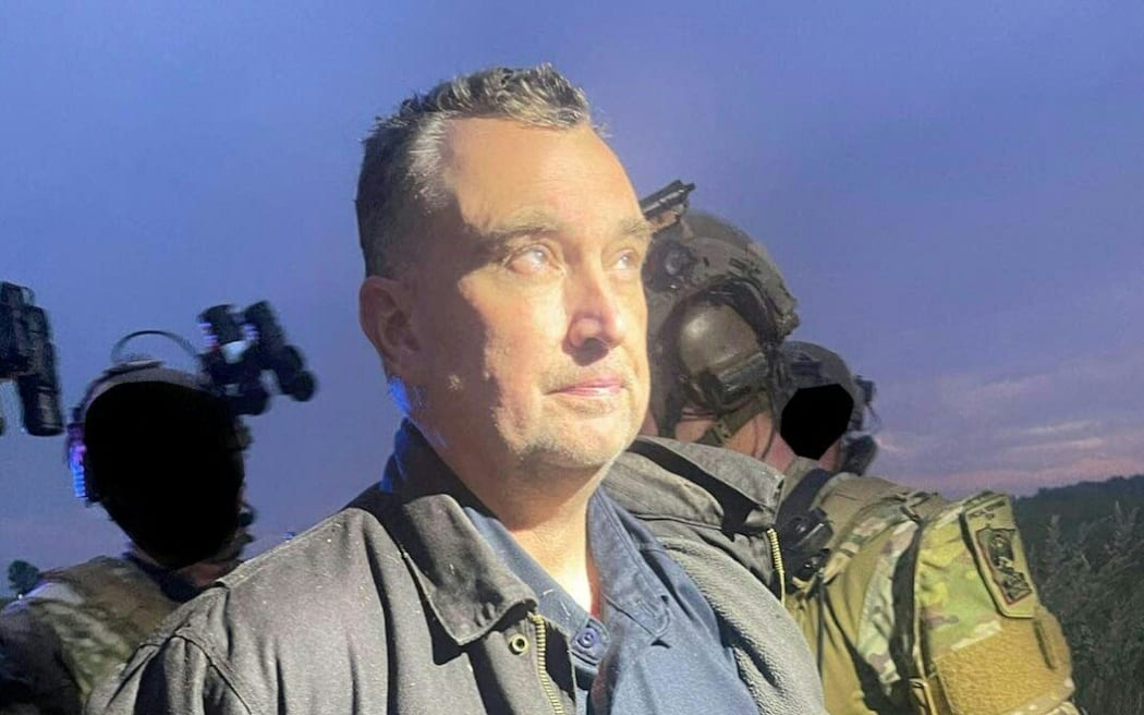 This unlocated handout photo released by the Ramsey County Sheriff's Office on June 15, 2025 shows Vance Boelter, the suspected killer of a Democratic Minnesota state lawmaker, as he was being apprehended. US law enforcement officials in Minnesota said the suspected killer of a Democratic state lawmaker and her husband was taken into custody without force on June 15, after a two-day manhunt. "There was no use of force by any member of law enforcement that was out there, and the suspect was taken into custody without an use of force," Minnesota State Patrol Lieutenant Colonel Jeremy Geiger told a press conference. (Photo by Ramsey County Sheriff's Office / AFP) / RESTRICTED TO EDITORIAL USE - MANDATORY CREDIT "AFP PHOTO / RAMSEY COUNTY SHERIFF'S OFFICE  " - NO MARKETING NO ADVERTISING CAMPAIGNS - DISTRIBUTED AS A SERVICE TO CLIENTS