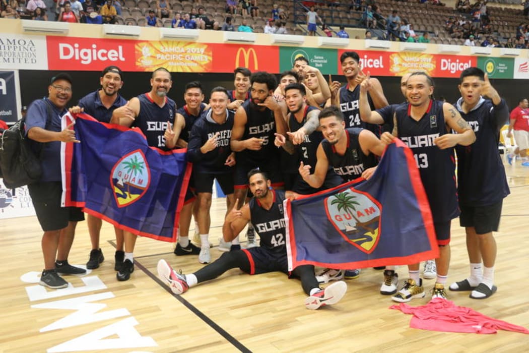 Guam celebrate winning gold at the 2019 Pacific Games.