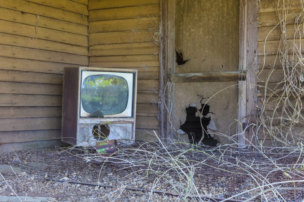 [Homestead, Georgia, United States] Old TV set on front porch of an abandoned homestead. (Photo by Mint Images / Mint Images / Mint Images via AFP)