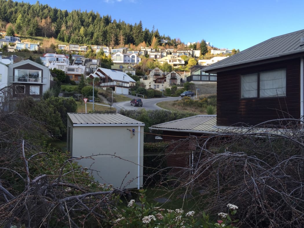 A portable sleep out cabin dropped into rental house garden.