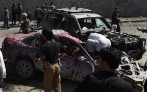 Afghan security forces inspecting the site.